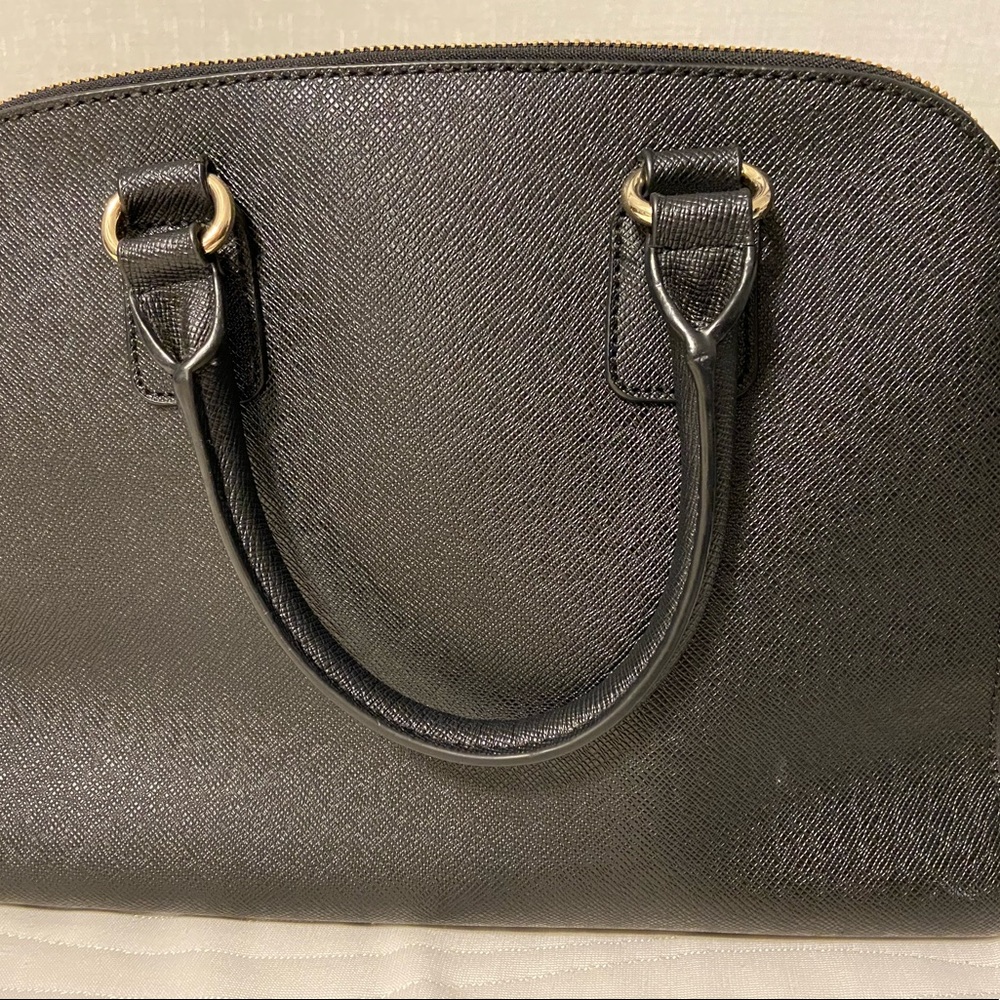 Black leather Aldo purse. It has been barely used. No signs of any wear